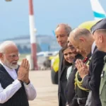 Man standing before a microphone, resembling a public speaking engagement by Narendra Modi, showcasing leadership and eloquence