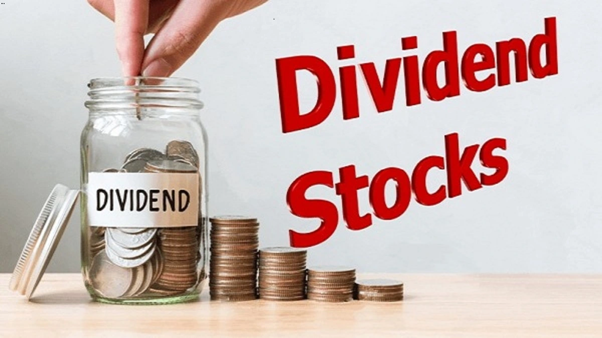 'Dividend Stocks' and various coins arranged to represent income from dividends.